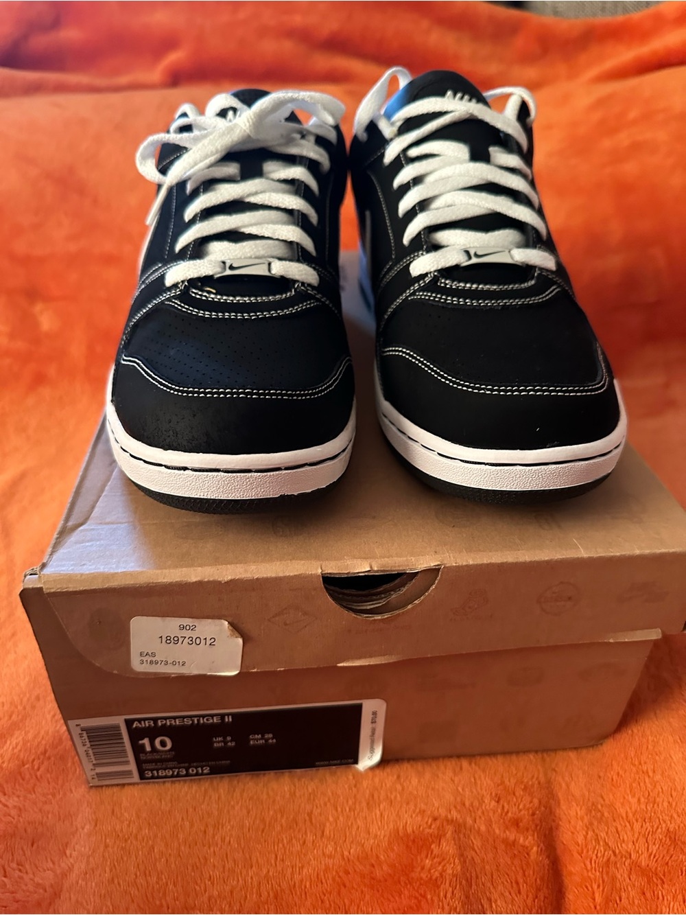 Men's Nike Air Prestige III sneakers featuring a black and white size 10
